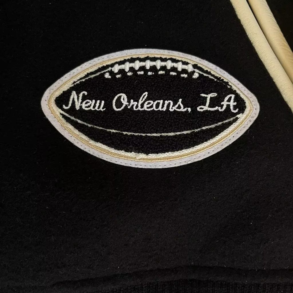 Men’s New Orleans Saints Varsity Jacket – Black and Cream Letterman Bomber Jacket with Football Patches